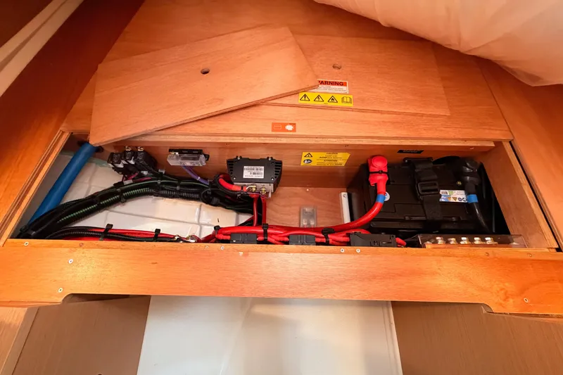 C'est Chic Yacht Photos Pics Electrical system of 2025 Jeanneau Sun Odyssey 350 sailboat, featuring wiring and battery components.