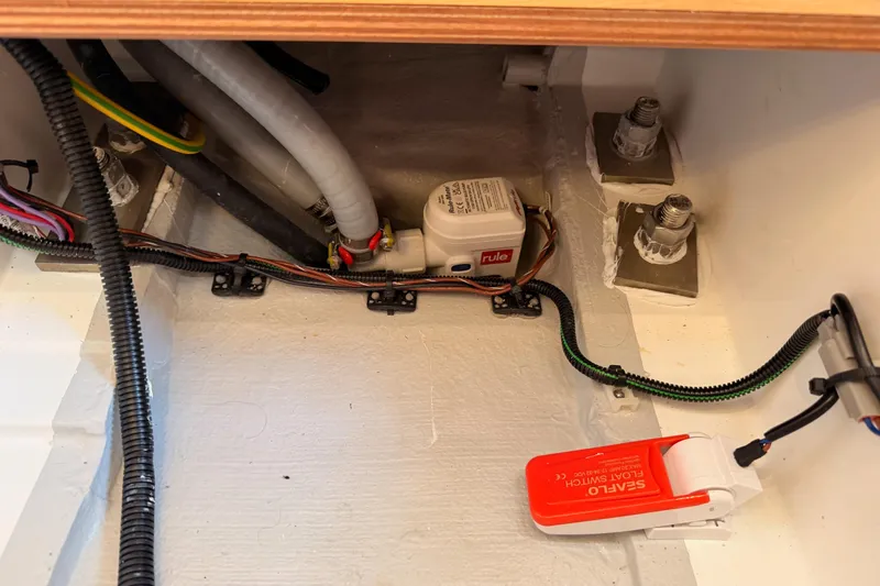 C'est Chic Yacht Photos Pics Bilge area of 2025 Jeanneau Sun Odyssey 350 with wiring and float switch.