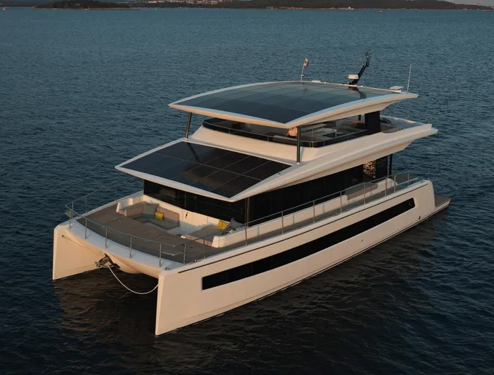  Yacht Photos Pics Silent 62 yacht, 2026 model, featuring solar panels, cruising on calm blue waters.