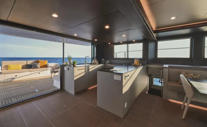  Yacht Photos Pics Luxurious interior of 2026 Silent 62 yacht with modern kitchen and ocean view.
