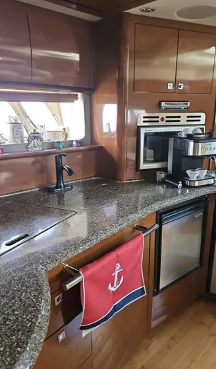 Marcello Yacht Photos Pics Luxurious kitchen interior of 2008 Sea Ray Sundancer yacht with modern appliances and granite countertops.