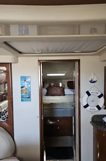 Marcello Yacht Photos Pics Interior of 2008 Sea Ray Sundancer yacht, featuring cozy cabin with nautical decor.