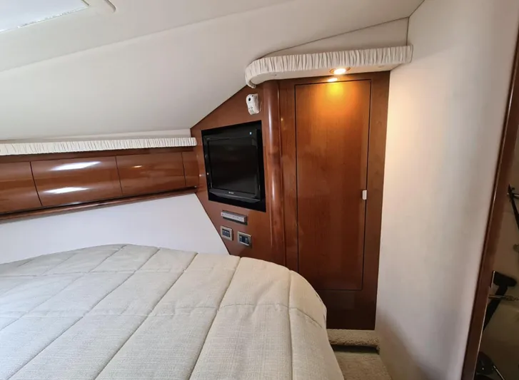 Marcello Yacht Photos Pics Luxurious 2008 Sea Ray Sundancer cabin interior with wood paneling and cozy bedding.