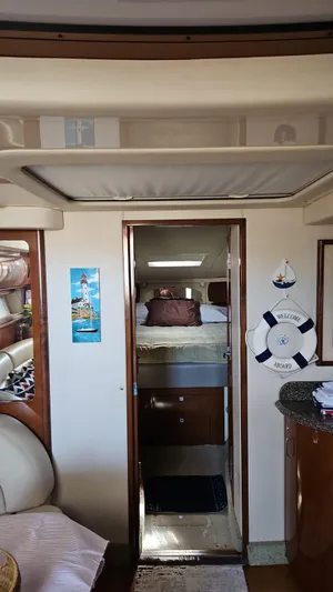 Marcello Yacht Photos Pics Interior of 2008 Sea Ray Sundancer yacht with cozy cabin and nautical decor.