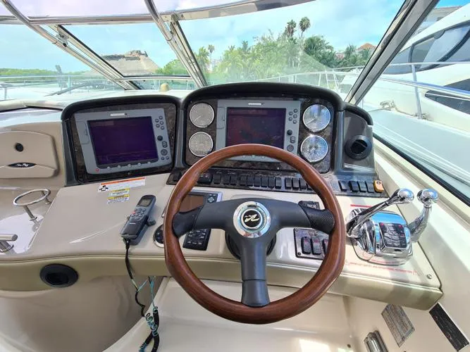 Marcello Yacht Photos Pics 2008 Sea Ray Sundancer helm with dual navigation screens and wooden steering wheel.