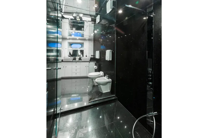 Unbridled Yacht Photos Pics Luxurious yacht bathroom with sleek black and white design, Crescent 116, 1995 model.