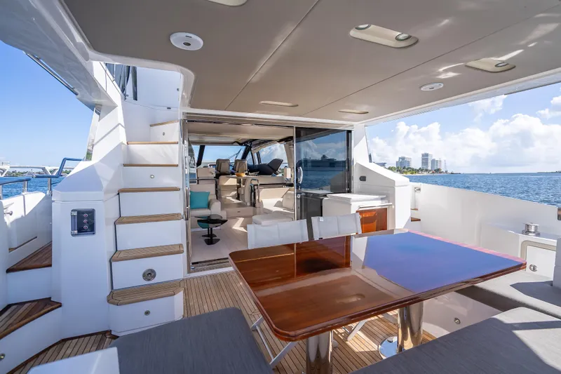  Yacht Photos Pics Luxurious 2019 Azimut 66 yacht interior with elegant dining area and ocean view.