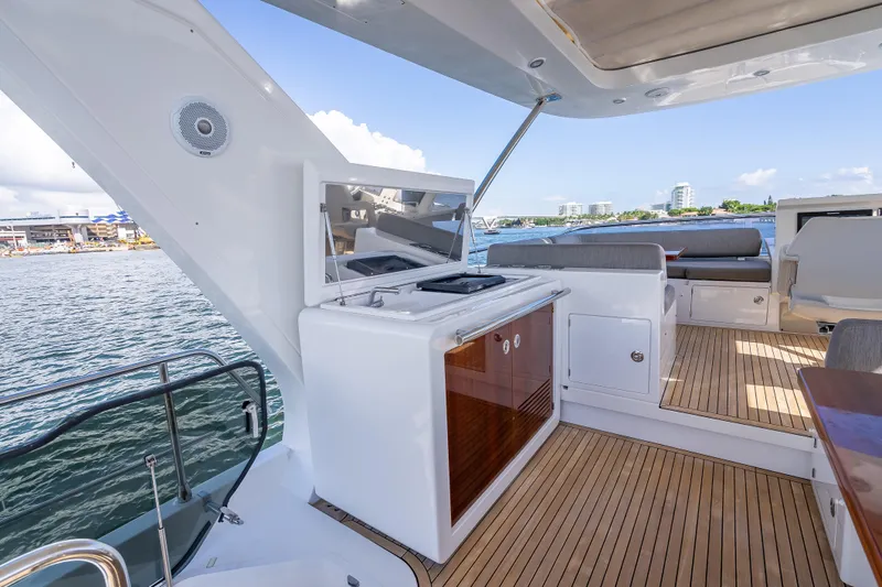  Yacht Photos Pics Luxurious 2019 Azimut 66 yacht deck with outdoor kitchen and seating area.
