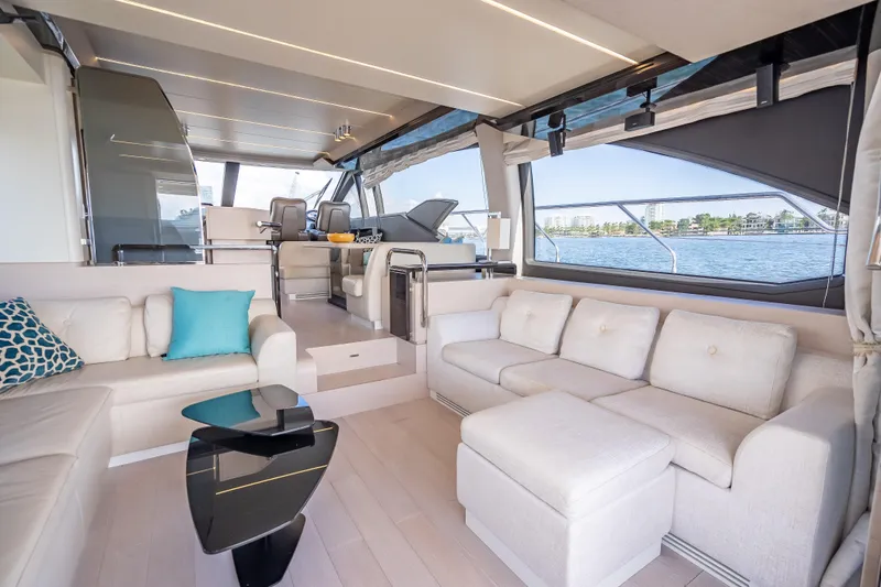  Yacht Photos Pics Luxurious interior of 2019 Azimut 66 yacht with elegant seating and panoramic windows.