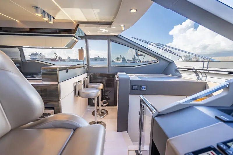  Yacht Photos Pics Luxurious interior of 2019 Azimut 66 yacht with modern seating and panoramic windows.