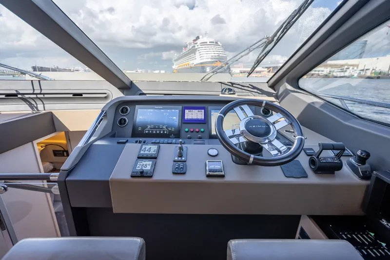  Yacht Photos Pics Cockpit of 2019 Azimut 66 yacht with modern navigation controls and steering wheel.
