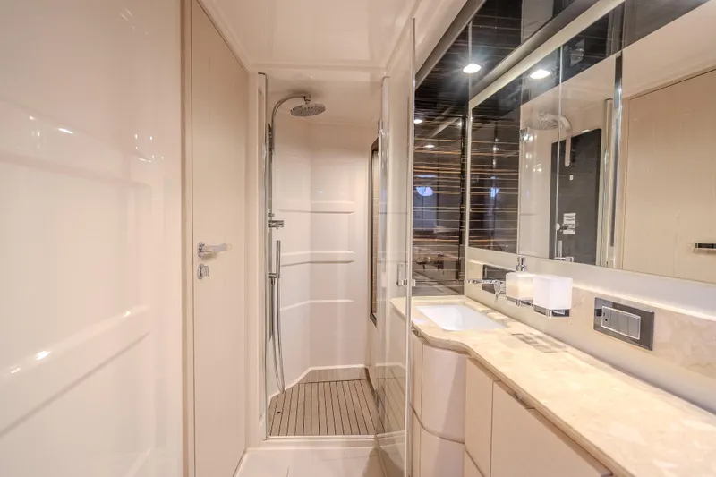  Yacht Photos Pics Luxurious bathroom interior of 2019 Azimut 66 yacht with modern shower and sleek design.