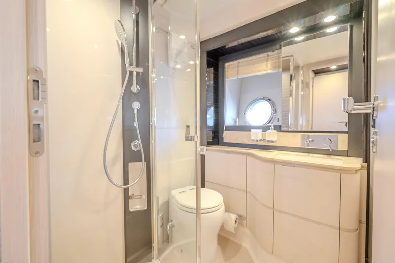  Yacht Photos Pics Luxurious bathroom in 2019 Azimut 66 yacht with modern shower and elegant fixtures.