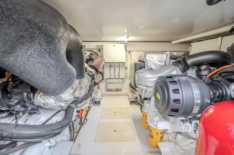  Yacht Photos Pics Engine room of 2019 Azimut 66 yacht, showcasing advanced machinery and components.