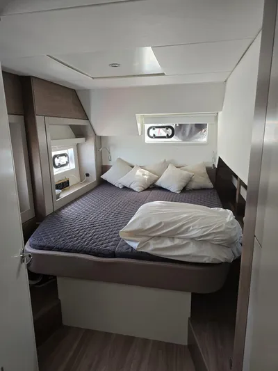 Catacha Yacht Photos Pics Cozy bedroom in 2022 Bali 4.6 yacht with modern design and comfortable bedding.