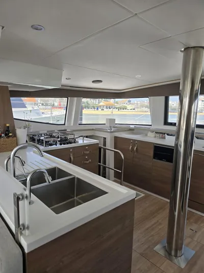 Catacha Yacht Photos Pics Modern kitchen interior on 2022 Bali 4.6 yacht, featuring sleek design and stainless steel appliances.