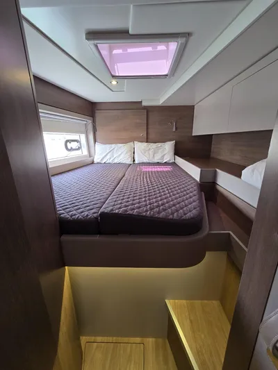 Catacha Yacht Photos Pics Cozy cabin interior of 2022 Bali 4.6 yacht with double bed and skylight.