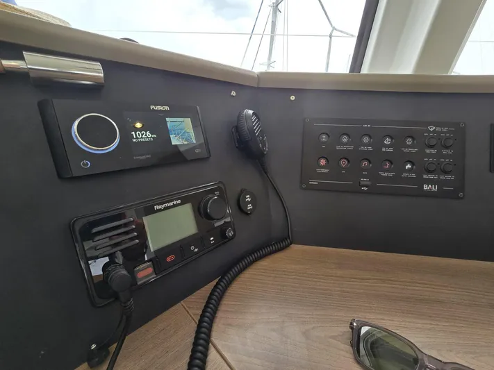 Catacha Yacht Photos Pics Control panel of a 2022 Bali 4.6 yacht with navigation and communication equipment.