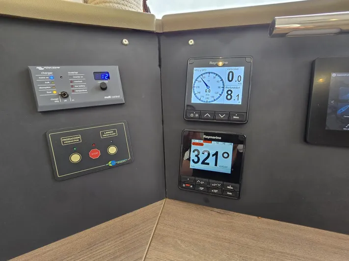 Catacha Yacht Photos Pics Control panel of a 2022 Bali 4.6 yacht with navigation displays and instruments.