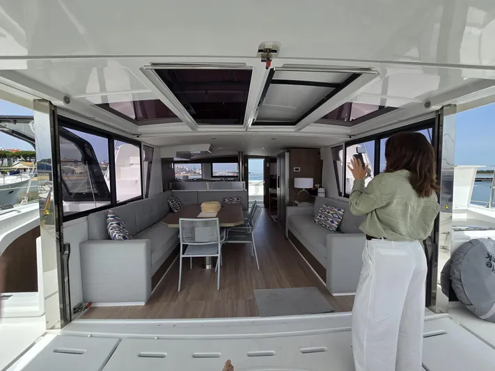 Catacha Yacht Photos Pics Modern Bali 4.6 yacht interior with spacious seating and dining area, 2022 model.