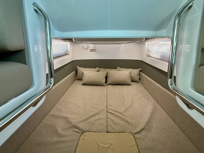 Good Vibes Yacht Photos Pics 2023 Axopar 37 Cross Cabin interior with cozy bed and modern design.