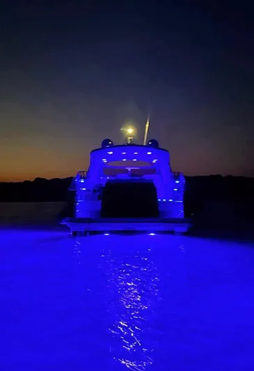  Yacht Photos Pics Luxury yacht Absolute 56, 2008 model, illuminated with blue lights at sunset.