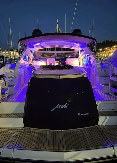  Yacht Photos Pics Luxury Absolute 56 yacht, 2008 model, illuminated with vibrant blue lights at night.