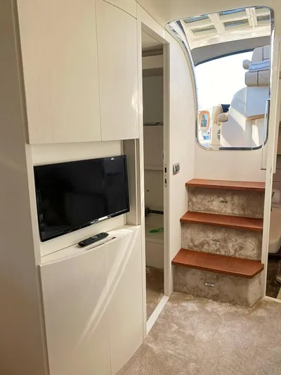  Yacht Photos Pics Interior of 2008 Absolute 56 yacht with TV, stairs, and modern design.