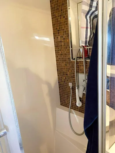  Yacht Photos Pics Shower area in 2008 Absolute 56 yacht with mosaic tiles and modern fixtures.