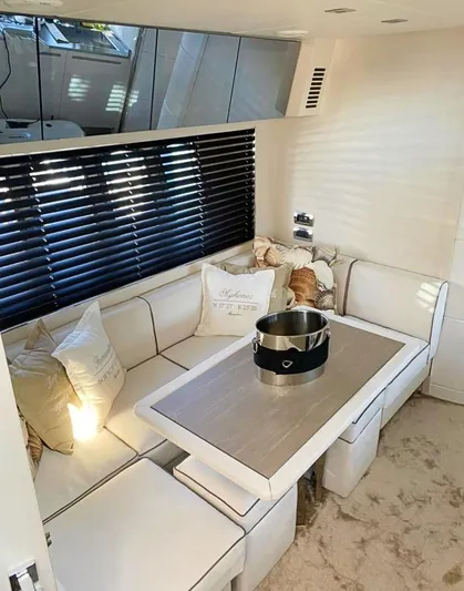  Yacht Photos Pics Luxurious interior of a 2008 Absolute 56 yacht with elegant seating and table.