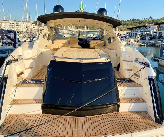  Yacht Photos Pics Luxury Absolute 56 yacht, 2008 model, docked in a marina with elegant teak decking.