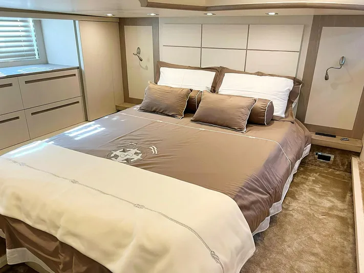  Yacht Photos Pics Luxurious bedroom interior on a 2008 Absolute 56 yacht, featuring a plush bed and elegant decor.