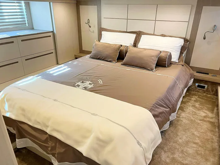  Yacht Photos Pics Luxurious bedroom interior on a 2008 Absolute 56 yacht, featuring a plush bed and elegant decor.