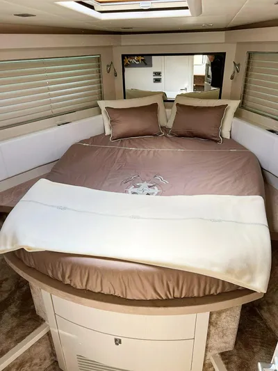  Yacht Photos Pics Luxurious bedroom interior of a 2008 Absolute 56 yacht with elegant bedding and modern design.