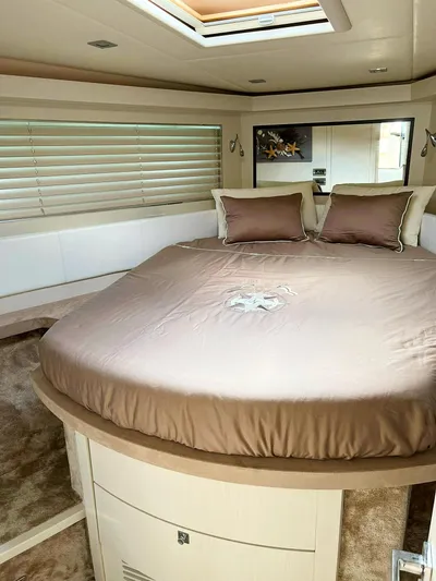 Yacht Photos Pics Luxurious bedroom interior of a 2008 Absolute 56 yacht with elegant bedding and modern design.