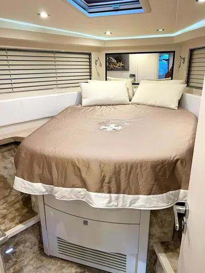  Yacht Photos Pics Luxurious bedroom interior on a 2008 Absolute 56 yacht, featuring a cozy bed and modern decor.
