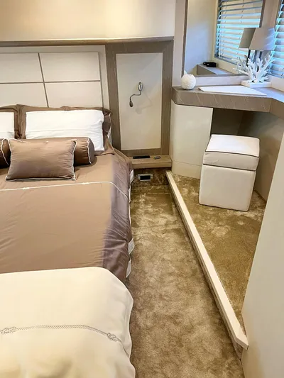  Yacht Photos Pics Luxurious bedroom interior in a 2008 Absolute 56 yacht, featuring elegant bedding and plush carpeting.