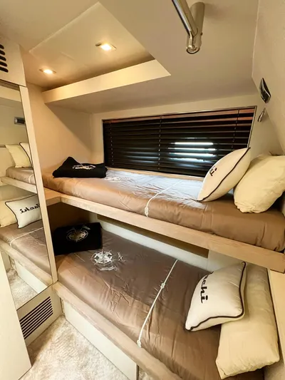  Yacht Photos Pics Bunk beds in a 2008 Absolute 56 yacht cabin with cozy bedding and modern lighting.