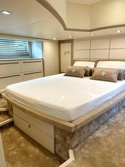  Yacht Photos Pics Luxurious bedroom interior in a 2008 Absolute 56 yacht, featuring elegant design and cozy bedding.