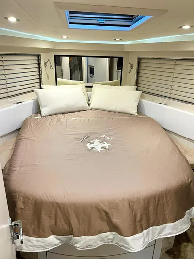  Yacht Photos Pics Luxurious bedroom interior in a 2008 Absolute 56 yacht with skylight and modern decor.