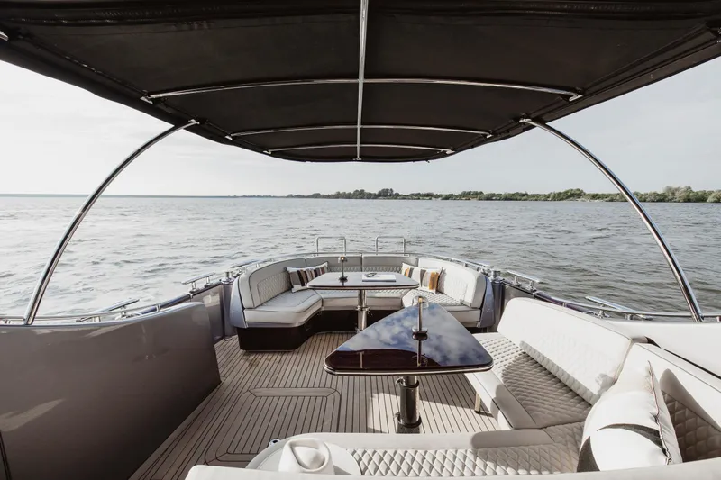 Baateaux Yacht Photos Pics Luxurious 2024 Zeelander 5 yacht interior with elegant seating and scenic water view.