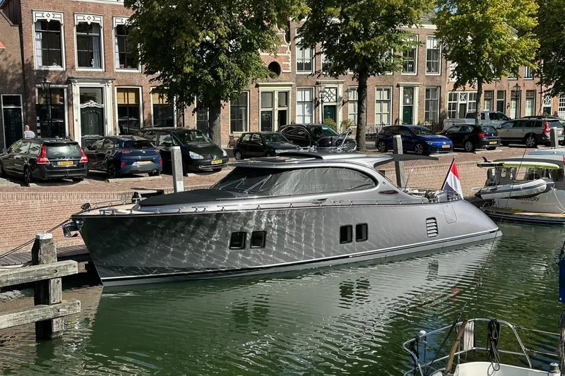 Baateaux Yacht Photos Pics 2024 Zeelander 5 yacht docked in a picturesque canal setting.