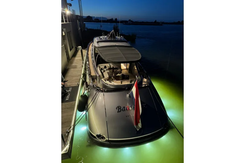 Baateaux Yacht Photos Pics 2024 Zeelander 5 yacht docked at night with glowing underwater lights.