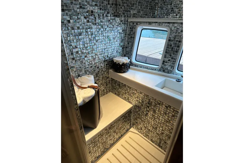 Baateaux Yacht Photos Pics Luxurious 2024 Zeelander 5 yacht bathroom with mosaic tiles and elegant fixtures.