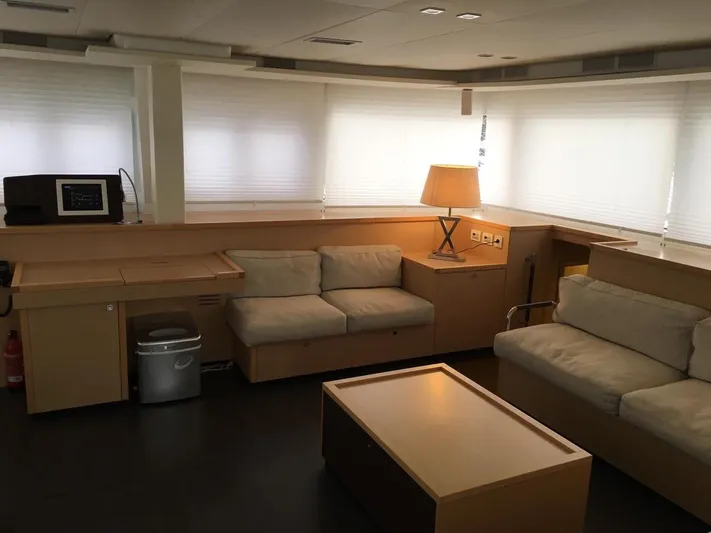  Yacht Photos Pics Interior of 2015 Lagoon 560 S2 yacht with modern furnishings and natural lighting.