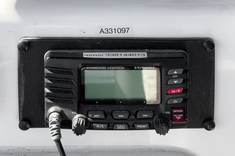 Lil' Breezy Yacht Photos Pics VHF radio on 2006 Riviera 33 Flybridge boat, displaying MMSI number.