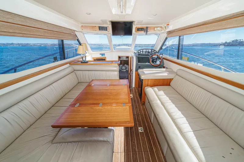 Lil' Breezy Yacht Photos Pics Luxurious interior of 2006 Riviera 33 Flybridge yacht with panoramic ocean views.