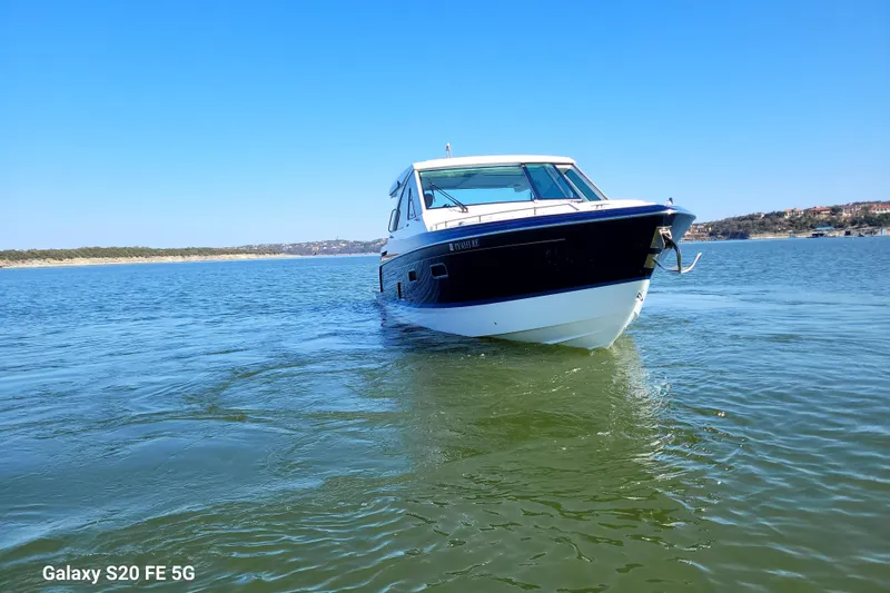 Master Plan Yacht Photos Pics 2023 Formula 380 Super Sport Crossover I/O cruising on a sunny lake.