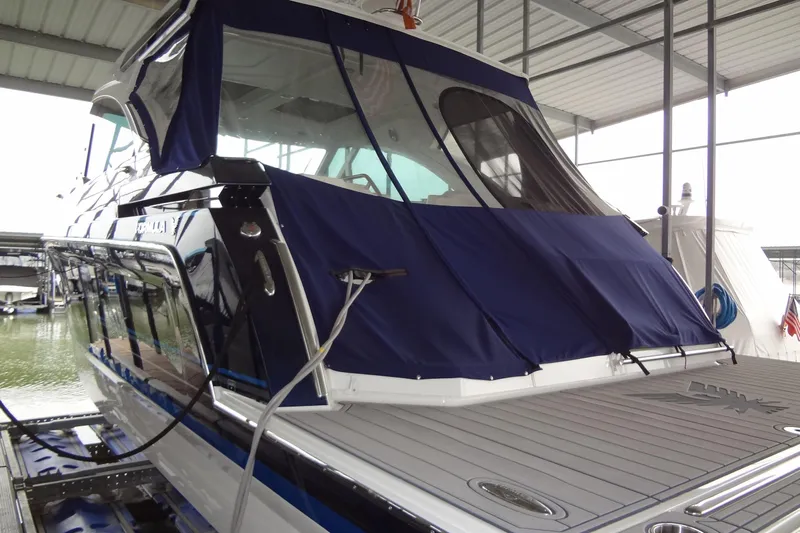 Master Plan Yacht Photos Pics 2023 Formula 380 Super Sport Crossover I/O docked under a covered marina.