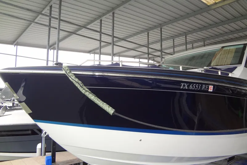 Master Plan Yacht Photos Pics 2023 Formula 380 Super Sport Crossover I/O boat docked in covered marina.